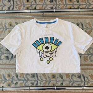 Noli White Tee with Blue and Yellow Eye Design